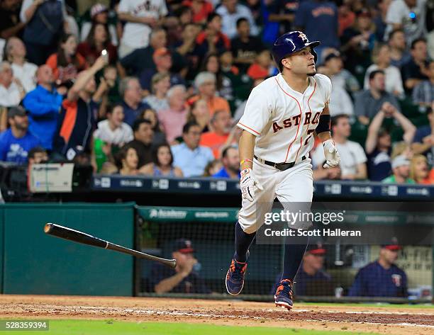 Jose Altuve of the Houston Astros connects on a two-run double in the fifth inning during their game against the Minnesota Twins at Minute Maid Park...