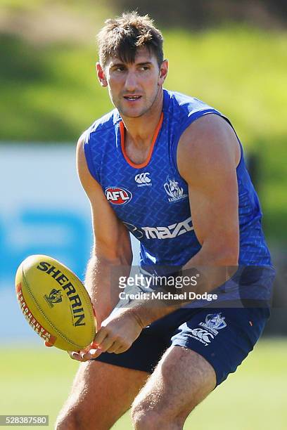 Jarrad Waite of the Kangaroos handballs during a North Melbourne Kangaroos AFL media session at Arden Street Ground on May 5, 2016 in Melbourne,...