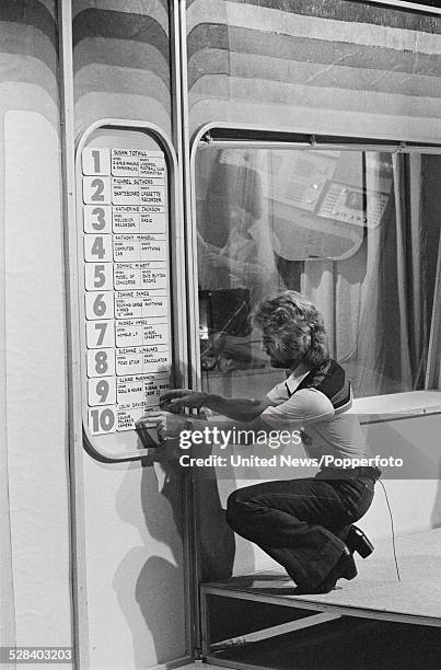 English DJ and television presenter, Noel Edmonds pictured presenting the children's television programme, Multi-Coloured Swap Shop at BBC television...