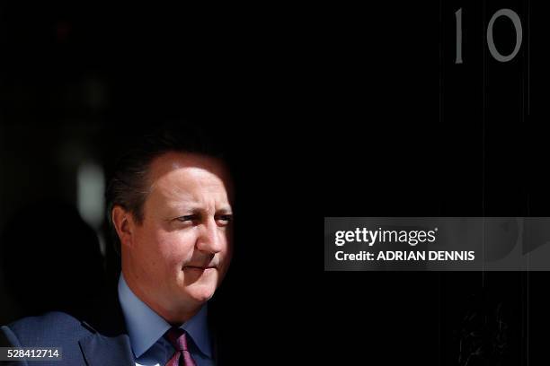 British Prime Minister David Cameron exits 10 Downing Street in central London on May 5 as he waits to greet Japanese Prime Minister Shinzo Abe ahead...