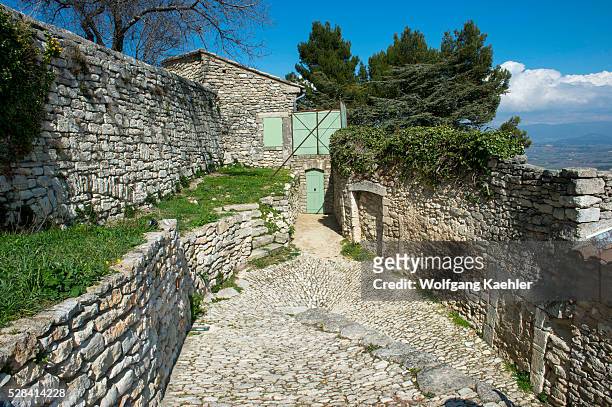 Cobblestone street in the hillside village of Lacoste in the Luberon in the Provence-Alpes-C��te d'Azur region in southeastern France.