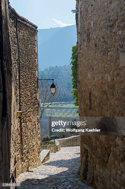 Cobblestone street in the hillside village of Lacoste in the Luberon in the Provence-Alpes-C��te d'Azur region in southeastern France.