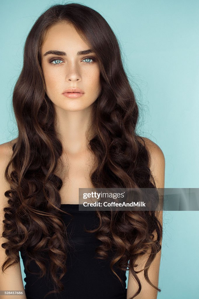 Studio shot of young beautiful woman