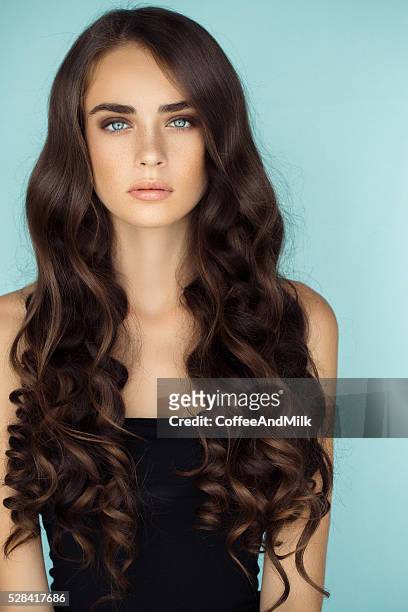 studio shot of young beautiful woman - hair type stock pictures, royalty-free photos & images