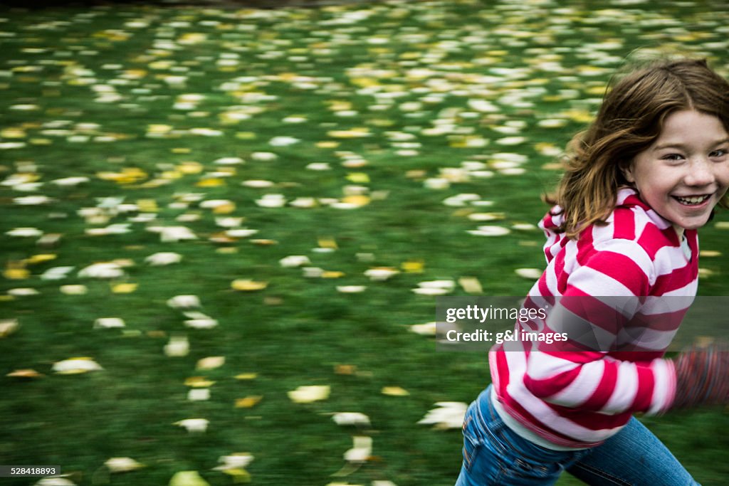 Girl (7yrs) running in yard