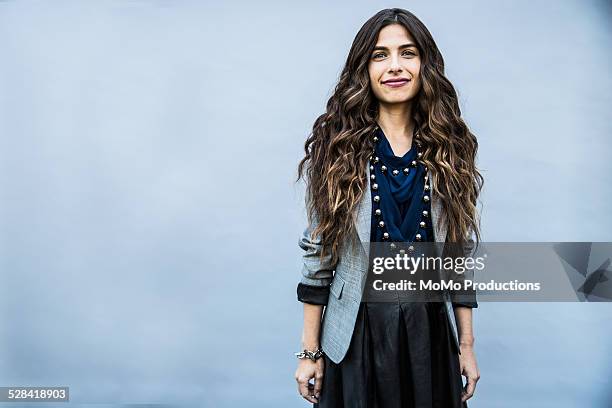 portrait of young woman on plain background