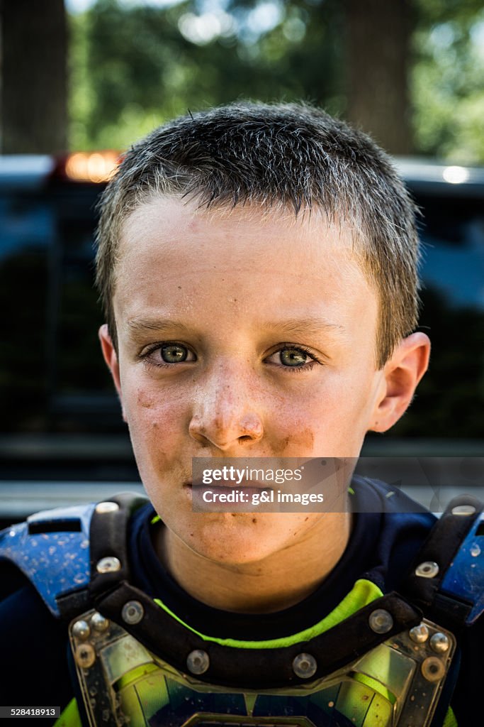 Motorcyclist (10yrs) with muddy face