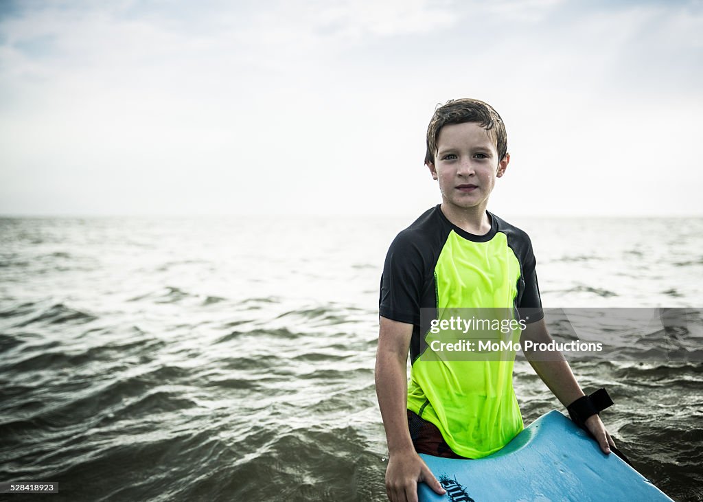 Boy (10yrs) standing in ocean