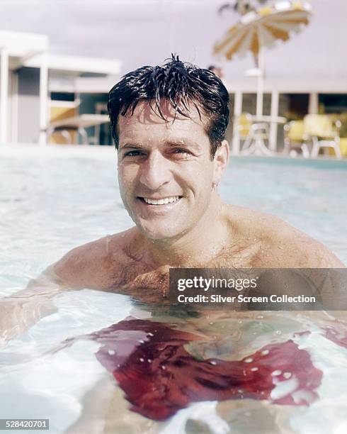 American actor Hugh O'Brian in a swimming pool, circa 1965.