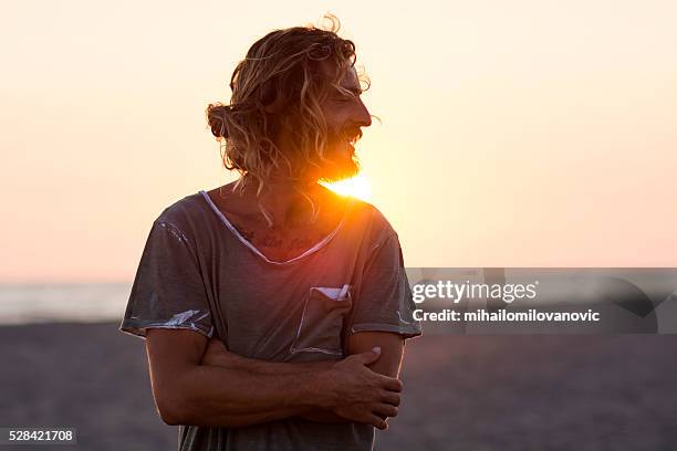 portrait and sunset at the beach - strand of human hair stock pictures, royalty-free photos & images