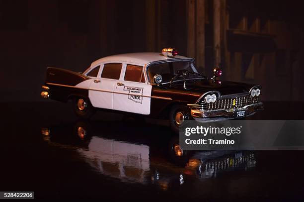 old american police car model at night - 1950 2016 stock pictures, royalty-free photos & images