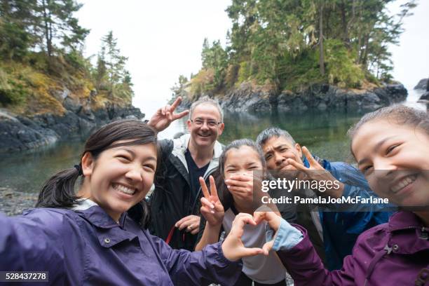 selfie of hikers making heart and peace signs with hands - family selfie stock pictures, royalty-free photos & images