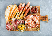 Meat appetizer selection or wine snack set. Variety of smoked