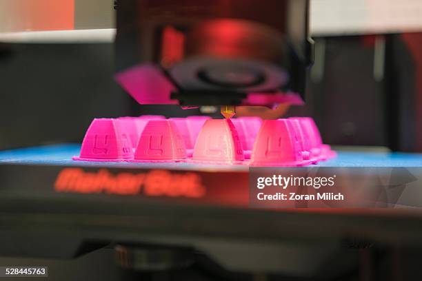 Printer making plastic cubes.