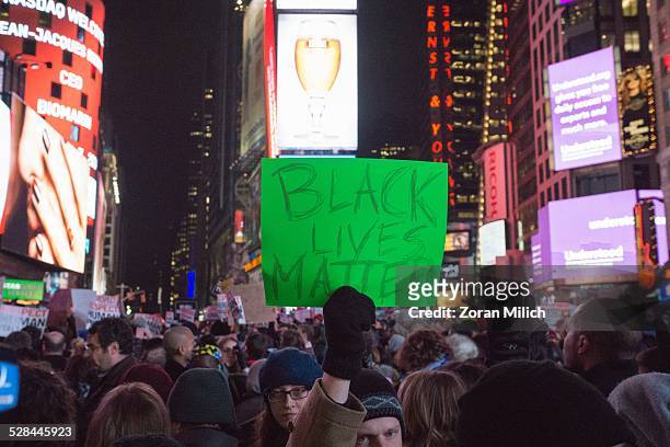 Dec 2014 New York USA Protesters for Eric Gardener and Michael Brown Brown during a hands up protest walk into Times Square. A Grand jury would not...