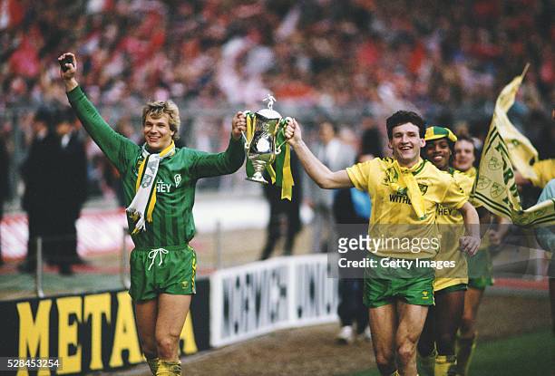 Norwich City players Chris Woods and Dave Watson celebrate with the trophy after the 1985 League Cup Final win against Sunderland at Wembley Stadium...