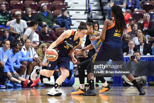 Kelly Faris of the Connecticut Sun handles the ball against the Chicago Sky on May 4, 2016 at the Mohegan Sun in Uncasville, Connecticut. NOTE TO...