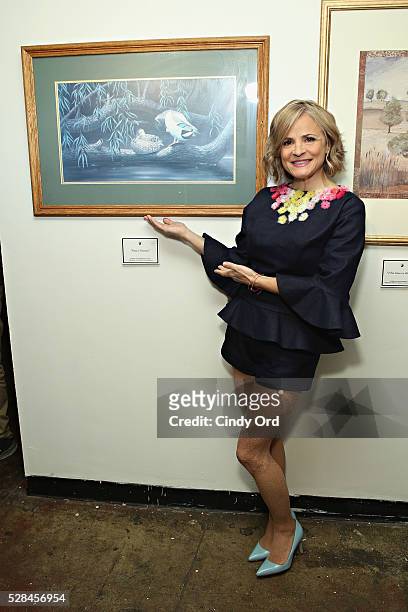 Actress and author Amy Sedaris poses for photo during a one-of-a-kind gallery event to giveaway the brand's old hotel art and celebrate the modern...