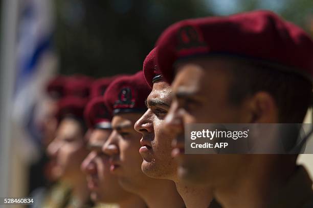 Israeli Soldiers stand at attention during a ceremony marking the annual Holocaust Remembrance Day at the Yad Vashem Holocaust Memorial in Jerusalem...