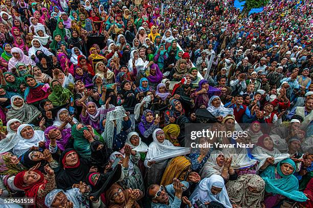 Kashmiri Muslims pray as a head priest displays the holy relic believed to be the whisker from the beard of the Prophet Mohammed on the occasion of...