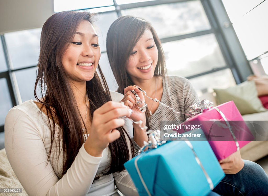 Girls opening presents