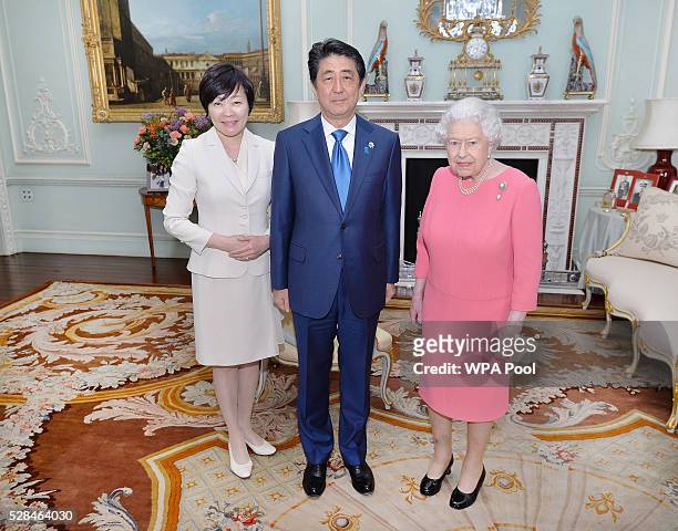 Queen Elizabeth II with the Prime Minister of Japan Shinzo Abe and wife Akie after they arrived for a private audience at Buckingham Palace on May 4,...