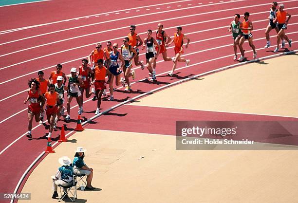 Visually-impaired runners, with sighted guides in orange tops, competing at the Summer Paralympics in Sydney, Australia, 23rd October, 2000....