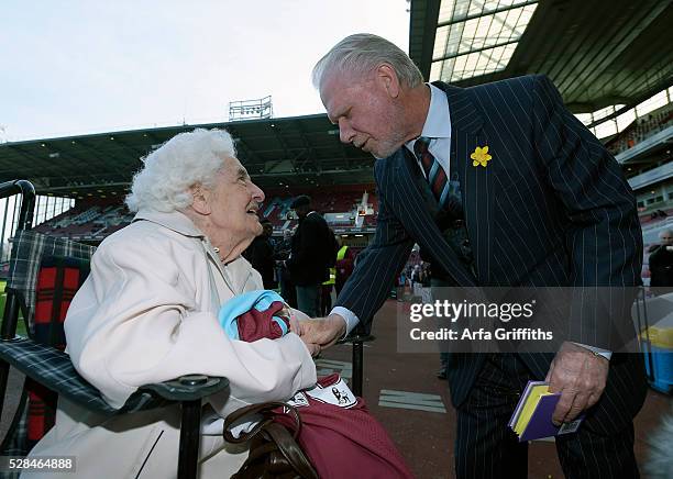 Mable Arnold, a 100 year old West Ham United Fan, is presented with a shirt prior to the match between West Ham United and Crystal Palace by West Ham...