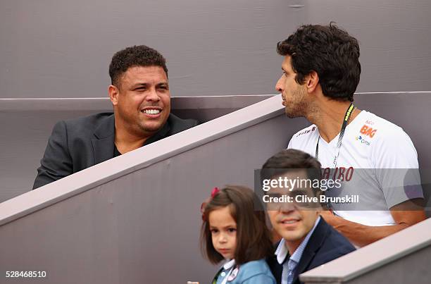 Ex Brazilian and Real Madrid footballer Ronaldo and Brazilian tennis player Marcelo Melo watch Jamie Murray of Great Britain and Bruno Soares of...