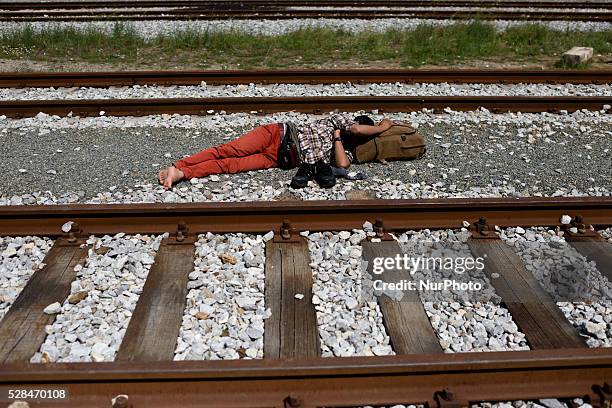 Refugees sleeps near the rails of the abandoned train station at Idomeni refugee camp on May 5'th, 2016. Thousands of migrants are still located in...