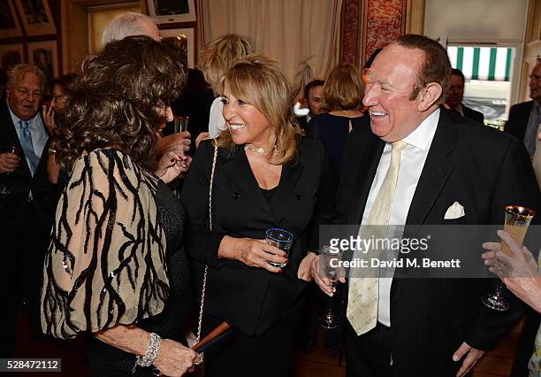 Dame Joan Collins, Eve Pollard and Andrew Neil attend the launch of Dame Joan Collins' new book "The St. Tropez Lonely Hearts Club" at Harry's Bar on...