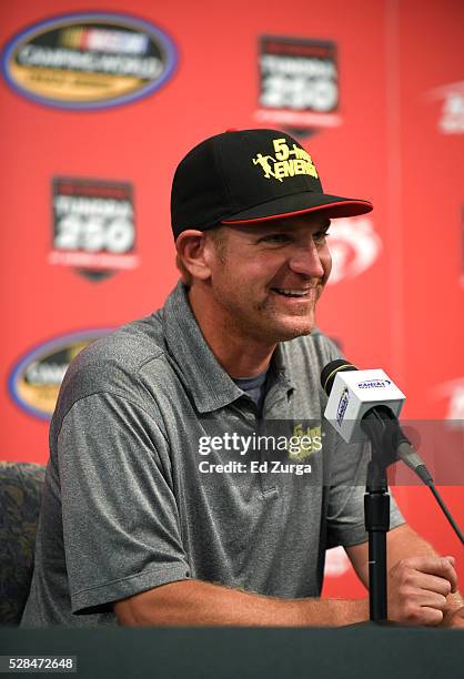 Clint Bowyer, driver of the 5-Hour Energy Chevrolet, talks to the media prior to a practice sessions for the Toyota Tundra 250 at Kansas Speedway on...