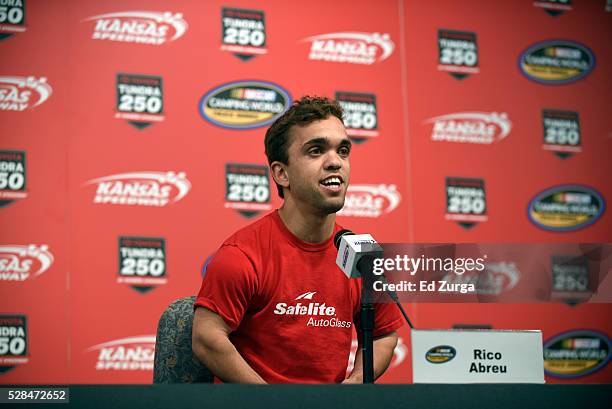 Rico Abreu, driver of the Safelite Toyota, talks to the media prior to a practice sessions for the Toyota Tundra 250 at Kansas Speedway on May 5,...