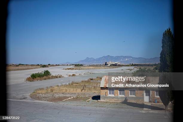 View from broken window at control tower to the terminal building at the abandoned Nicosia International Airport on April 28, 2016 in Nicosia, Cyprus...