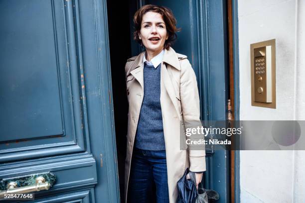 french businesswoman standing at the door - office door stock pictures, royalty-free photos & images