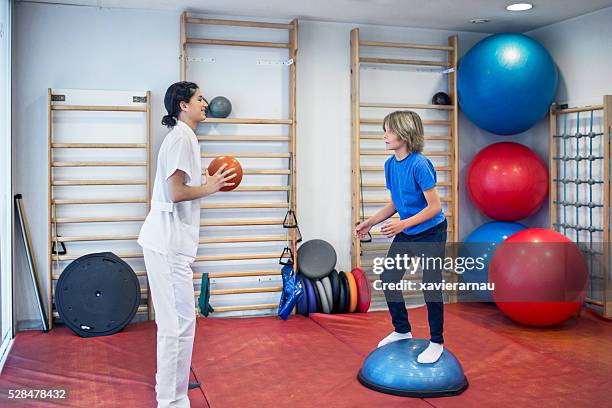 rehabilitation exercises with ball - big ball exercises stock pictures, royalty-free photos & images