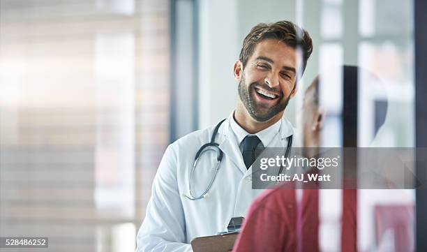 he always puts his patients at ease - man talking to doctor bildbanksfoton och bilder
