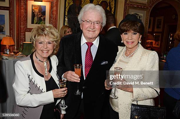 Gloria Hunniford, Leslie Bricusse and Yvonne Romain attend the launch of Dame Joan Collins' new book "The St. Tropez Lonely Hearts Club" at Harry's...