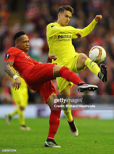 Nathaniel Clyne of Liverpool and Denis Suarez of Villarreal challenge for the ball during the UEFA Europa League semi final second leg match between...