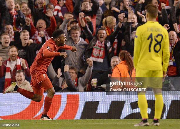 Liverpool's English striker Daniel Sturridge celebrates after scoring his team's second goal during the UEFA Europa League semi-final second leg...