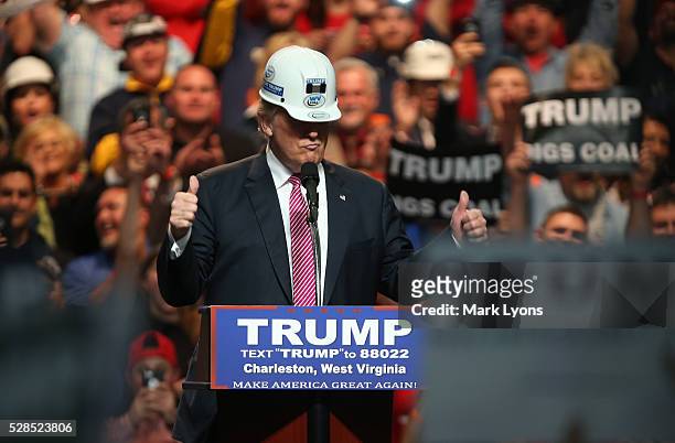 Republican Presidential candidate Donald Trump models a hard hat in support of the miners during his rally at the Charleston Civic Center on May 5,...
