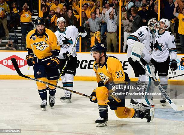 Colin Wilson of the Nashville Predators celebrates after scoring a goal against goalie Martin Jones of the San Jose Sharks during the first period of...