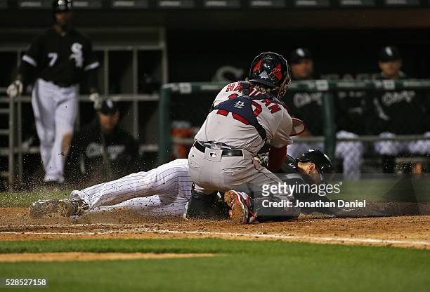 Brett Lawrie of the Chicago White Sox is tagged out at the plate by Ryan Hanigan of the Boston Red Sox to end the 5th inning at U.S. Cellular Field...