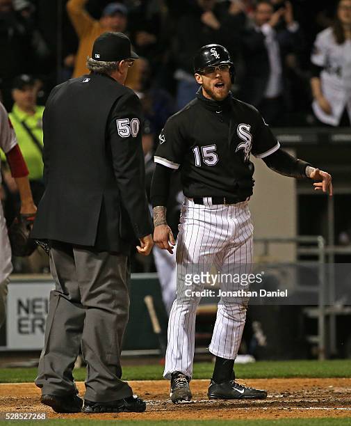 Brett Lawrie of the Chicago White Sox argues with home plate umpire Paul Emmel after being called out at the plate in the 5th inning against the...