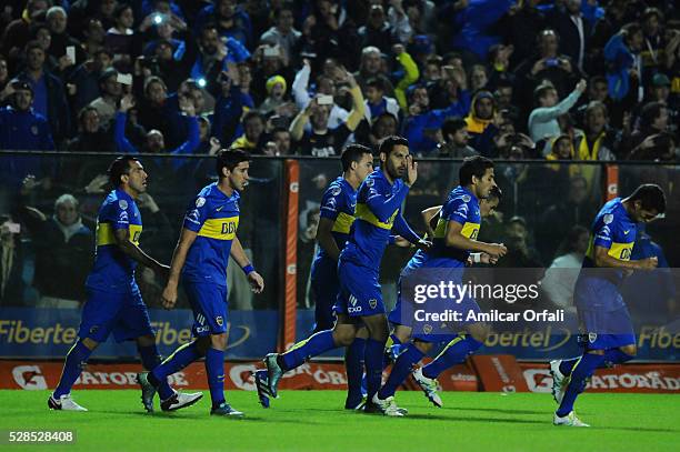 Carlos Tevez of Boca Juniors and his teammates celebrate the first goal of their team during a second leg match between Boca Juniors and Cerro...