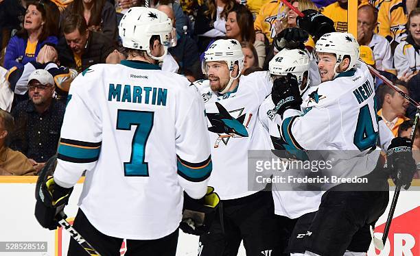 Paul Martin, Joonas Donskoi, Joel Ward, and Tomas Hertl celebrate after the game tying goal against of the Nashville Predators during the second...