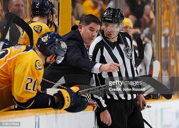 Peter Laviolette of the Nashville Predators argues a call with linesman Pierre Racicot in Game Four of the Western Conference Second Round against...