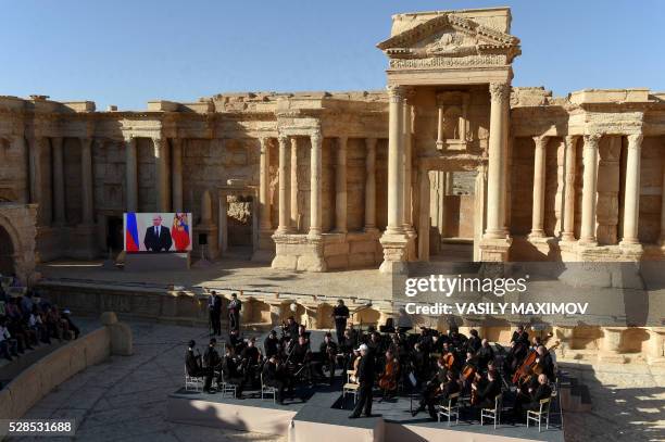 Russian conductor Valery Gergiev leads a concert in the amphitheatre of the ancient city of Palmyra on May 5, 2016.