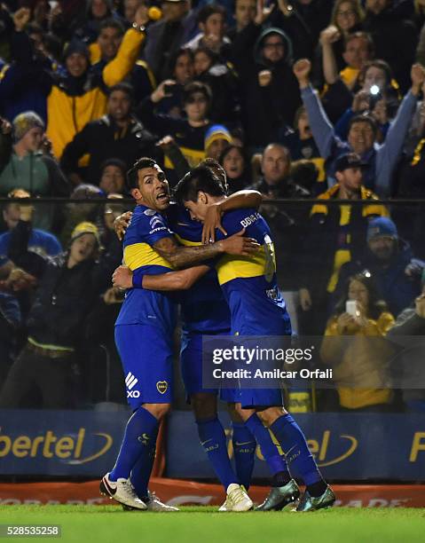 Pablo Perez of Boca Juniors celebrates with teammates after scoring the third goal of his team during a second leg match between Boca Juniors and...