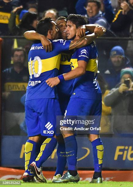 Pablo Perez of Boca Juniors celebrates with teammates after scoring the third goal of his team during a second leg match between Boca Juniors and...